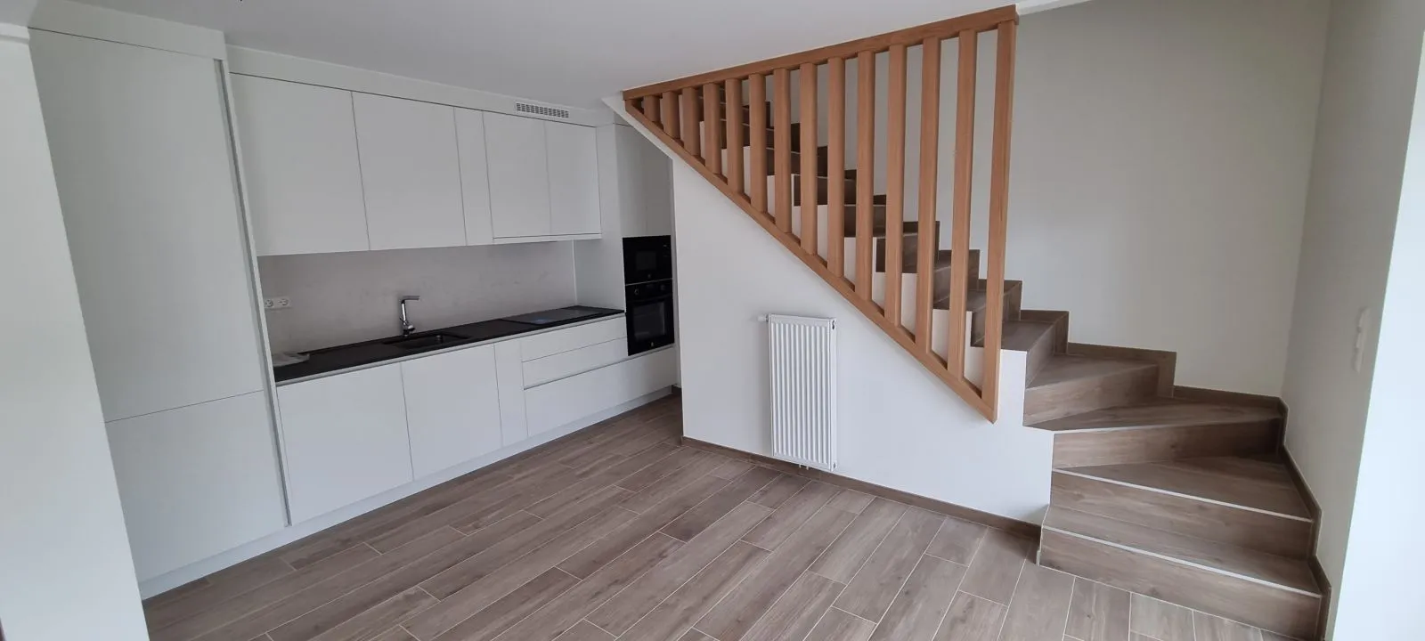 Moderne Küche nach der Renovierung durch BauArt in Luxemburg